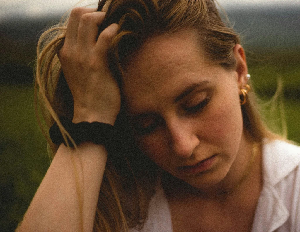 Person with ADHD practicing mindfulness and journaling to reduce worry and anxiety.