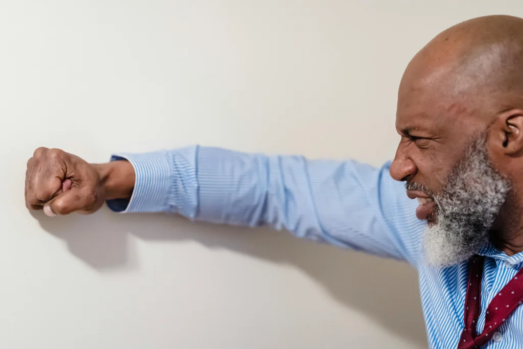 A calm person practicing deep breathing to manage anger, illustrating mindfulness and emotional control techniques.