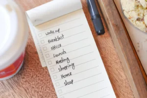 Handwritten self-care menu on a notepad listing 5-minute, 30-minute and few-hour activities
