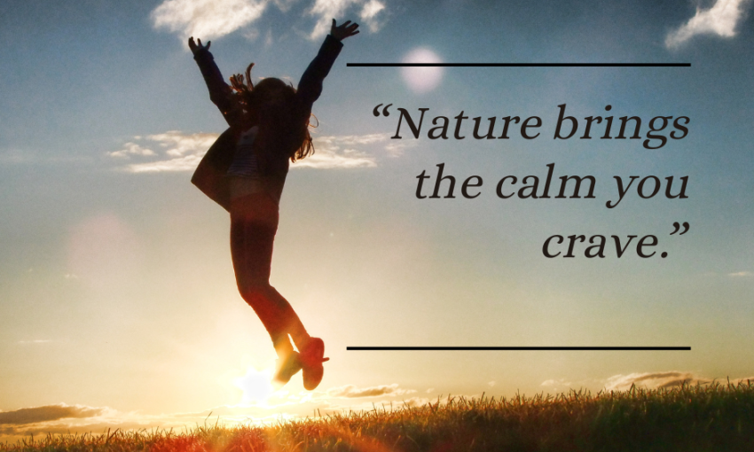 A person walking slowly through a forest or park, fully present and grounded in nature — representing mindfulness therapy and stress relief.
