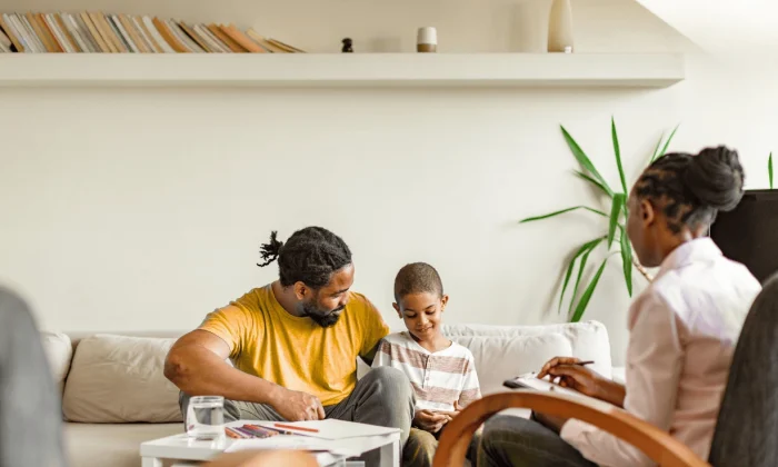 Parent using mindful parenting techniques to support a child with ADHD and emotional regulation.